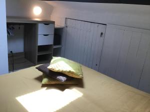 Ένα ή περισσότερα κρεβάτια σε δωμάτιο στο Face à la mer