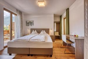 Postel nebo postele na pokoji v ubytování Hotel Stefanie