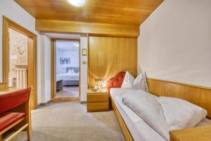 Postel nebo postele na pokoji v ubytování Hotel Stefanie