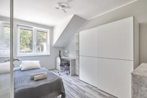 Rúm í herbergi á Gejzir Apart