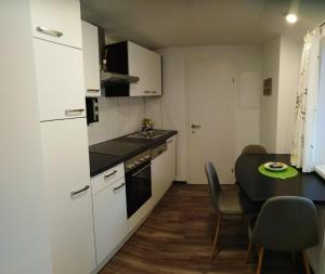 A kitchen or kitchenette at Ferienhaus Bauer Wohnung 2