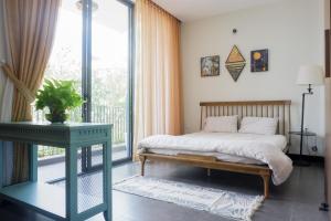 Postel nebo postele na pokoji v ubytování MyFa House