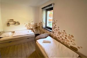 A bed or beds in a room at Chopok Juh - Ambiente Apartment