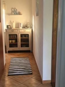 a kitchen with an oven and a rug on the floor at Dom pod Białym Pagajem in Pisz +26 photos