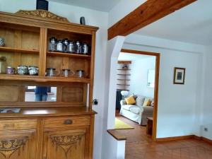 a living room with a large wooden hutch at Number15 Guesthouse Carcassonne in Carcassonne