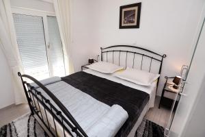 Posteľ alebo postele v izbe v ubytovaní Apartments ITD