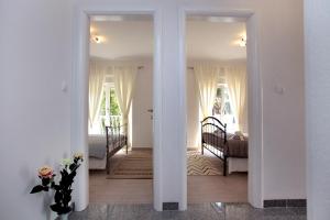 Posteľ alebo postele v izbe v ubytovaní Apartments ITD