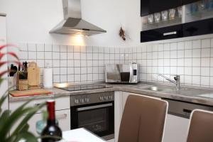 Kuchyňa alebo kuchynka v ubytovaní Apartments ITD