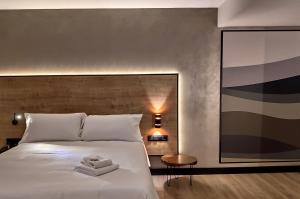 A bed or beds in a room at Ibis Styles Figueres Ronda
