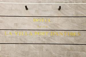 a sign that says hotel la villa port batteries at Hôtel La Villa Port d'Antibes & Spa in Antibes