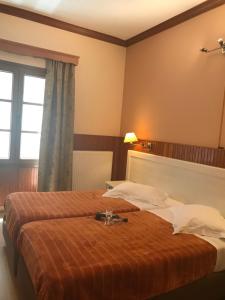 Postel nebo postele na pokoji v ubytování Hotel Olympic