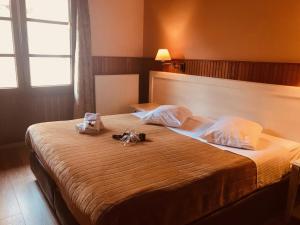 Postel nebo postele na pokoji v ubytování Hotel Olympic
