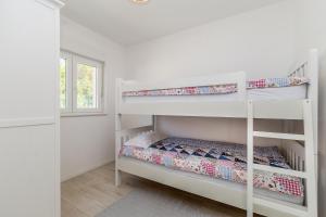 Postel nebo postele na pokoji v ubytování Holiday house MASLINA + 26 fotografií