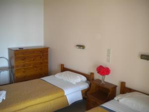 A bed or beds in a room at Akropolis studios