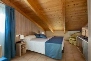 Posteľ alebo postele v izbe v ubytovaní Hotel Cannes - in pieno centro