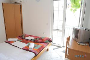 Postel nebo postele na pokoji v ubytování Apartmani Jedro