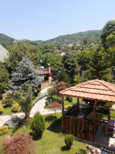 a view of a garden with a gazebo at Vacation Home Nukri in Gonio