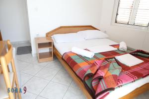 Postel nebo postele na pokoji v ubytování Apartmani Jedro