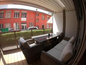 a view of a balcony with a table and chairs at La Casa - comfortable - by PA in Luzern