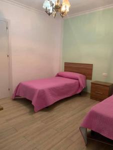 Posteľ alebo postele v izbe v ubytovaní CASA VACACIONAL CONIL