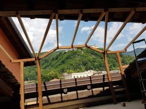 a view from the window of a building at Attico sul Fiume in Varallo