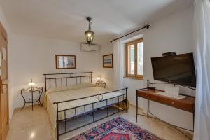 Ein Bett oder Betten in einem Zimmer der Unterkunft Villa Tuttorotto