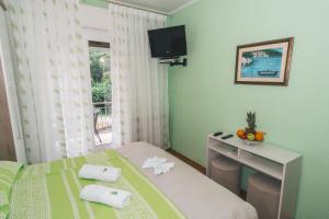TV a/nebo společenská místnost v ubytování Bed and Breakfast Rooms Sandalj