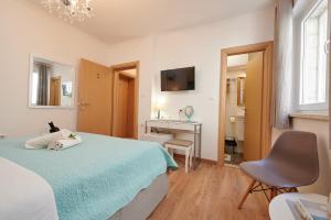 Posteľ alebo postele v izbe v ubytovaní Rooms Antonio