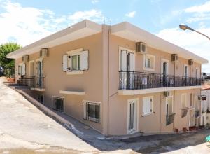 a building with balconies on the side of it at Angela in Loutra Edipsou