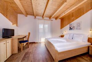 Postel nebo postele na pokoji v ubytování Hotel Stefanie