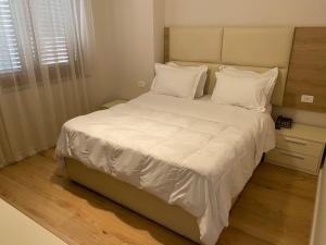 Postel nebo postele na pokoji v ubytování Hotel Vila e Arte City Center
