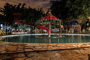 a large pool of water with a roller coaster at Hotel Fazenda Pé da Serra in Bom Sucesso +116 photos