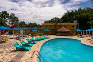 The swimming pool at or close to Hotel Fazenda Pé da Serra