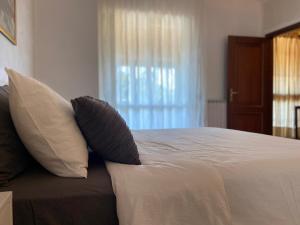 Posteľ alebo postele v izbe v ubytovaní Casa Rosaria