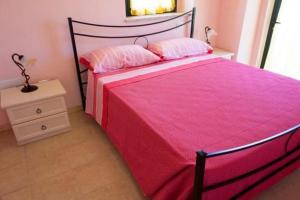 A bed or beds in a room at LA TANA DEL CINGHIALE