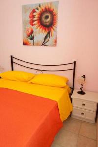 A bed or beds in a room at LA TANA DEL CINGHIALE