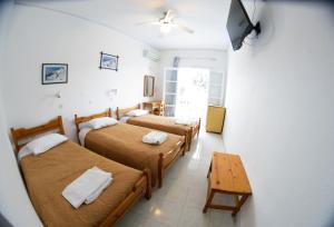 Postelja oz. postelje v sobi nastanitve Lefkothea Hotel