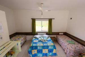 A bed or beds in a room at Hotel Fazenda Pé da Serra