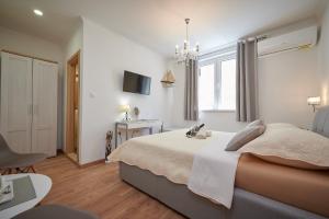 Posteľ alebo postele v izbe v ubytovaní Rooms Antonio