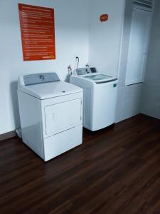 two washing machines are sitting in a room at Hotel Hi! Zapopan in Guadalajara