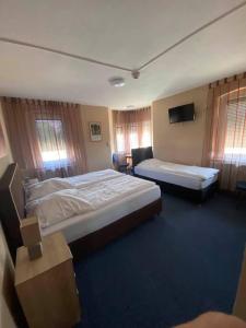 Postel nebo postele na pokoji v ubytování Hotel-Gasthof "Alter Ritter"