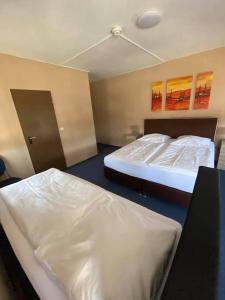 Postel nebo postele na pokoji v ubytování Hotel-Gasthof "Alter Ritter"