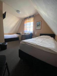 Postel nebo postele na pokoji v ubytování Hotel-Gasthof "Alter Ritter"