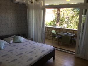 En eller flere senge i et værelse på Apartments Gemma