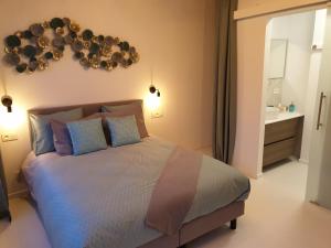 Llit o llits en una habitació de B&B Luxe Suites 1-2-3