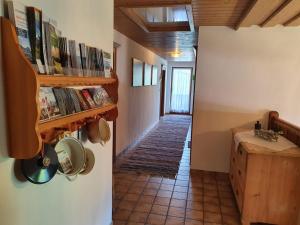 a hallway of a house with a staircase with books at Haus Strobler in Going