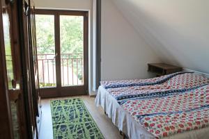 Posteľ alebo postele v izbe v ubytovaní Illés Apartman