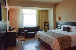 Postel nebo postele na pokoji v ubytování Hotel Portobelo