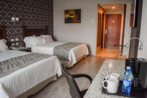 Letto o letti in una camera di Hotel Portobelo