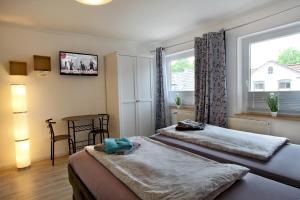 Postel nebo postele na pokoji v ubytování Sportpension "Seminarhaus an der Eider"